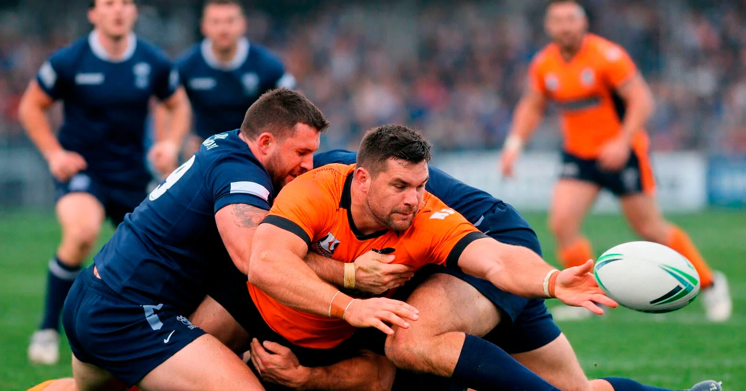 Rugby League player being tackled during a play